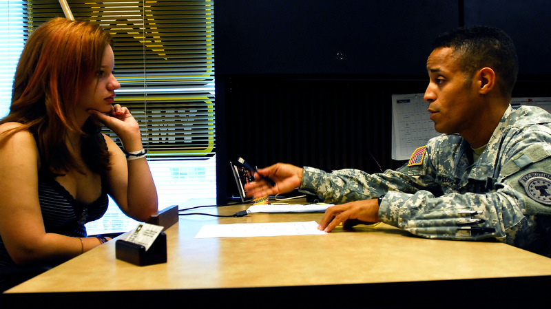 Maria Thompson,, left, listens to a recruitment speech from U.S. Army Staff Sgt. Allan Welchez Rivera (AP /Herminio Rodriguez)