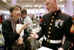 Amy Hagopian, co-chairwoman of the Garfield High PTSA, lights up Marine Sgt. Christopher Matthews in the school lunchroom. Hagopian is trying to get military recruiters barred from the school. The Marines and the Army have failed to meet recruiting quotas in recent months. Photo: Dan DeLong/Seattle Post-Intelligencer / SL.